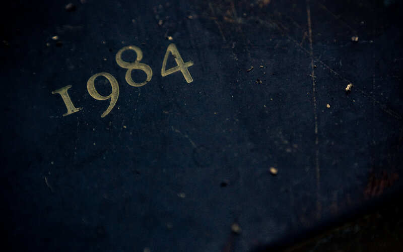 1984 engraved on dark surface