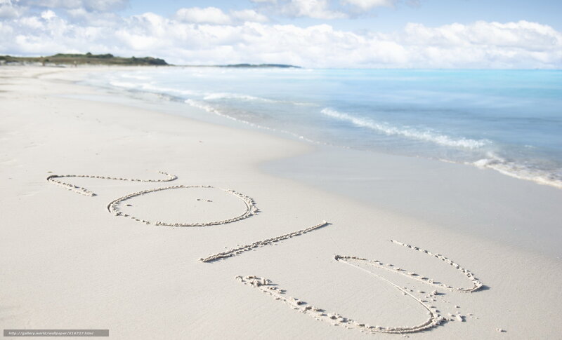 2013 written in sand on beach
