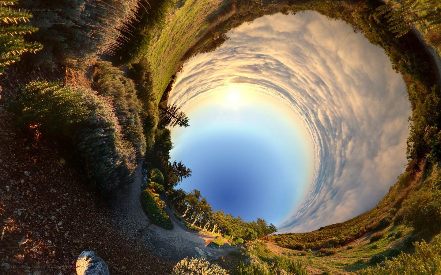 360-degree landscape with sun and clouds