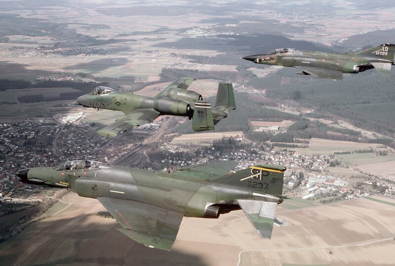 A-10 and F-4 fighter jets in formation