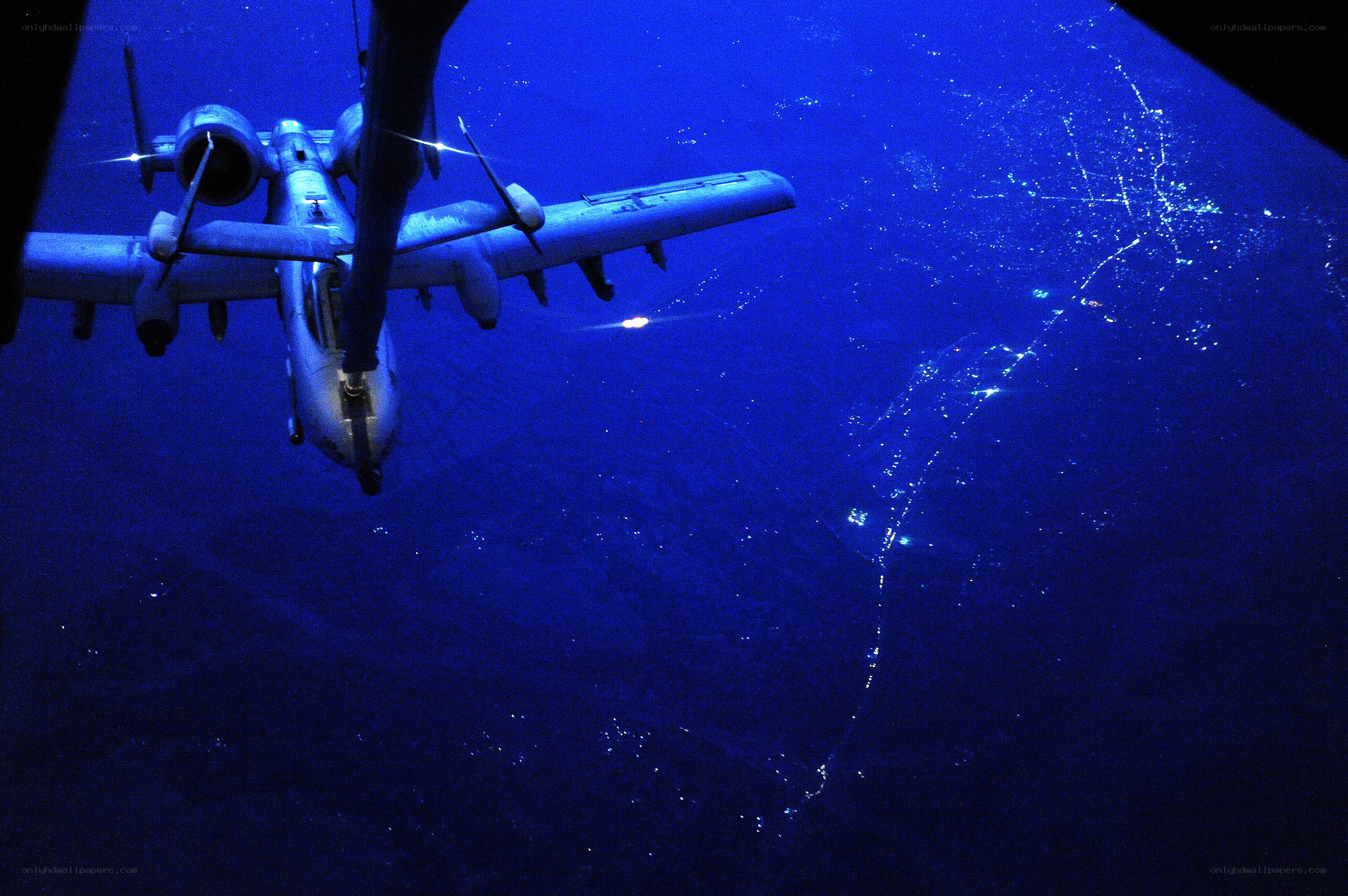 A-10 over a city at night
