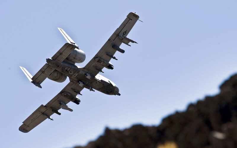 A-10 Thunderbolt II Aircraft — Blue, Dramatic, Afternoon, Photograph, Mountain