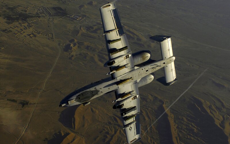 A-10 Thunderbolt II Aircraft — Gray, Dramatic, Afternoon, Photograph, Desert Landscape