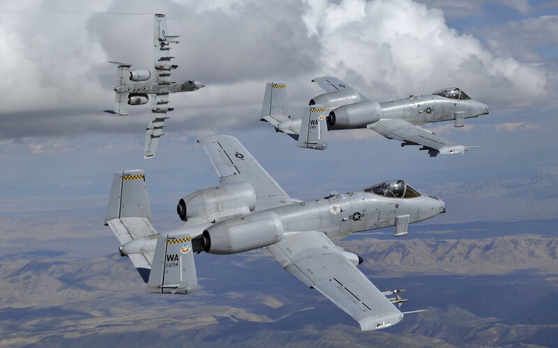 A-10 Thunderbolt II Aircraft — Gray, Dramatic, Afternoon, Photograph, Mountains, Clouds