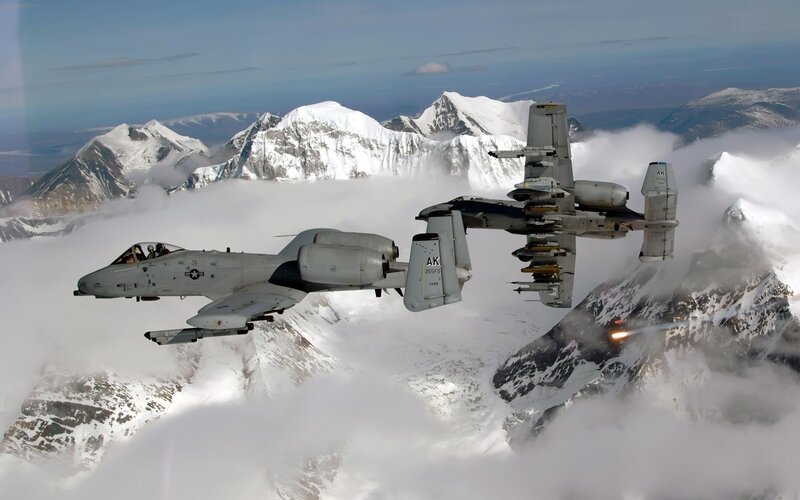 A-10 Thunderbolt II Aircraft — Gray, Dramatic, Photograph, Mountains, Clouds