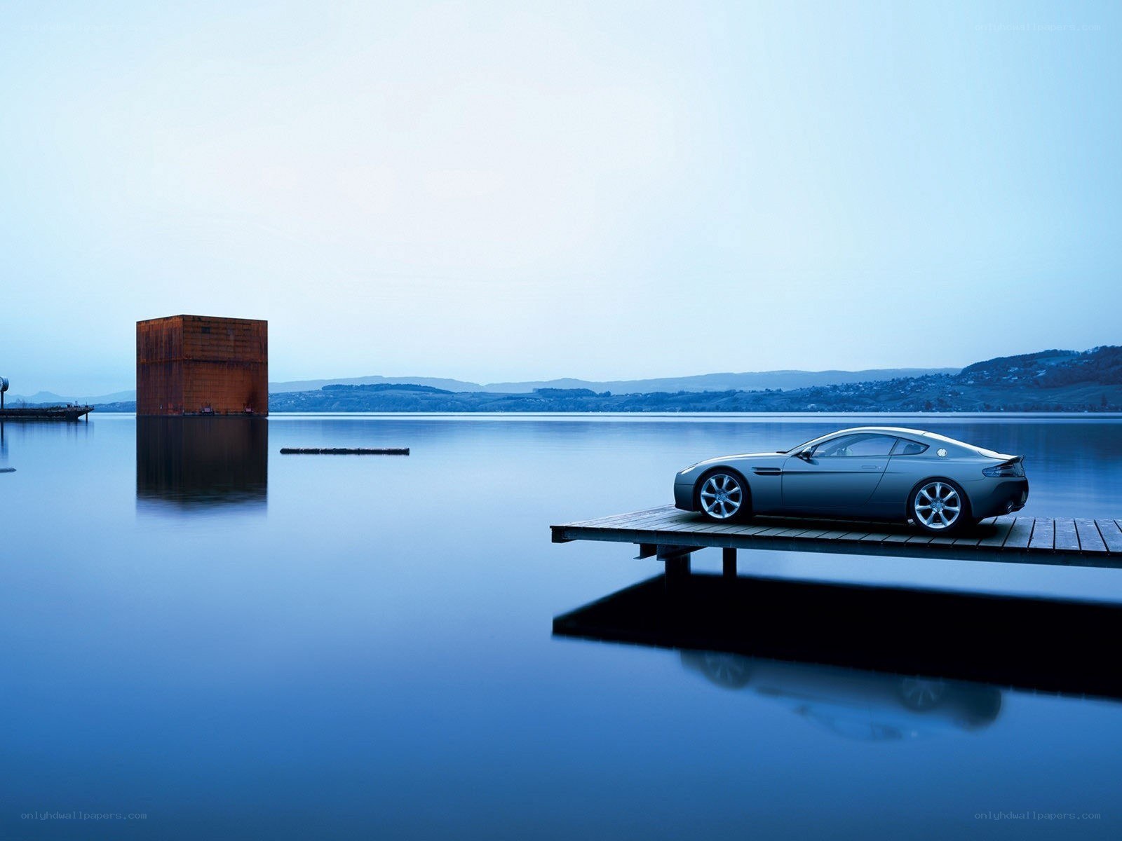 A car on a dock by the water