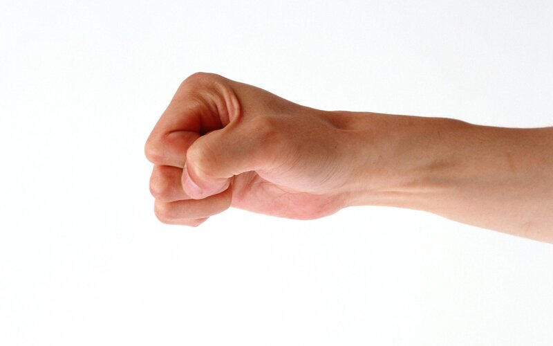 a clenched fist on white
