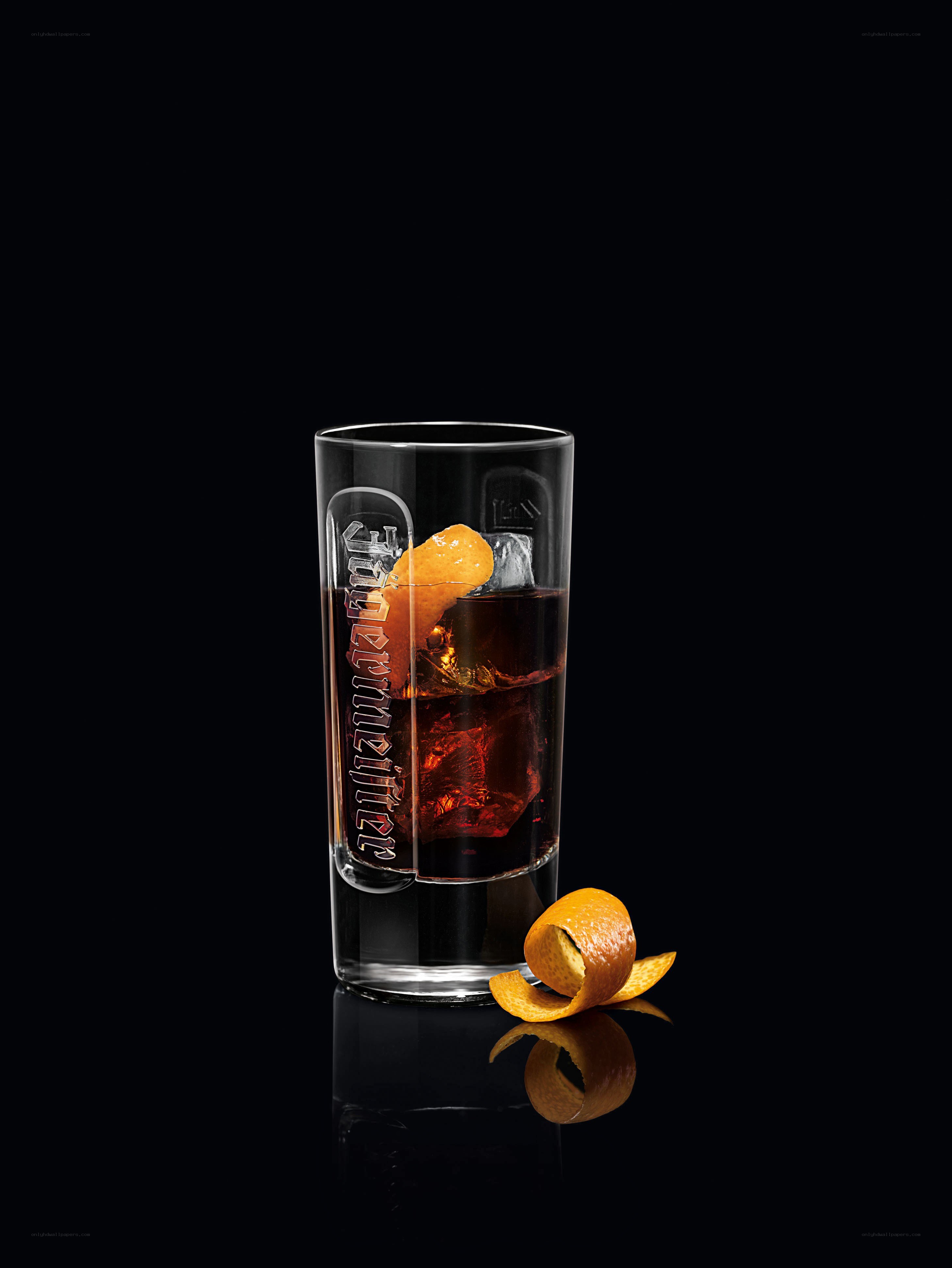 A cocktail with orange peel