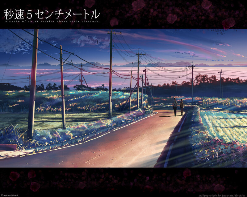 A couple walks a rural road at dusk
