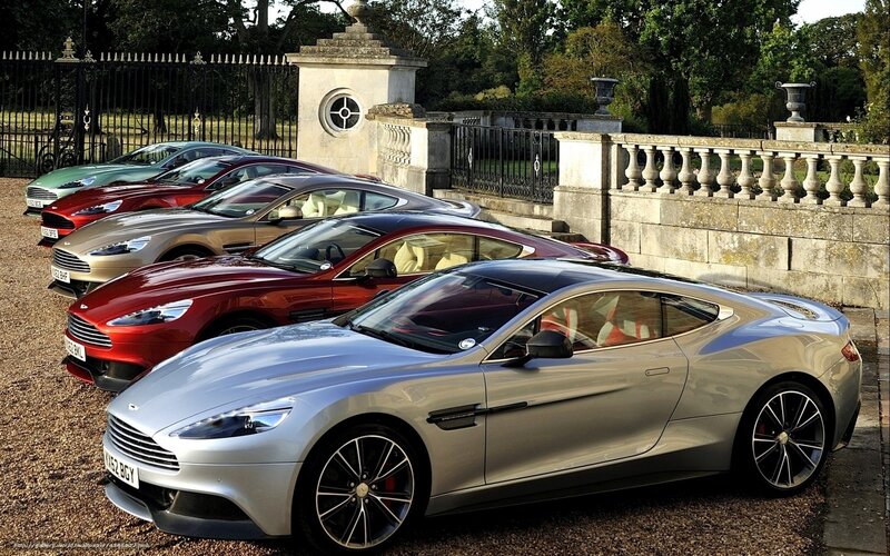 A lineup of Aston Martin cars