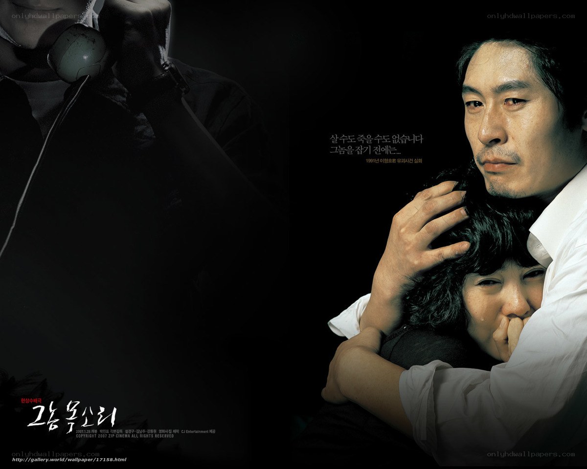 A man holds a crying woman