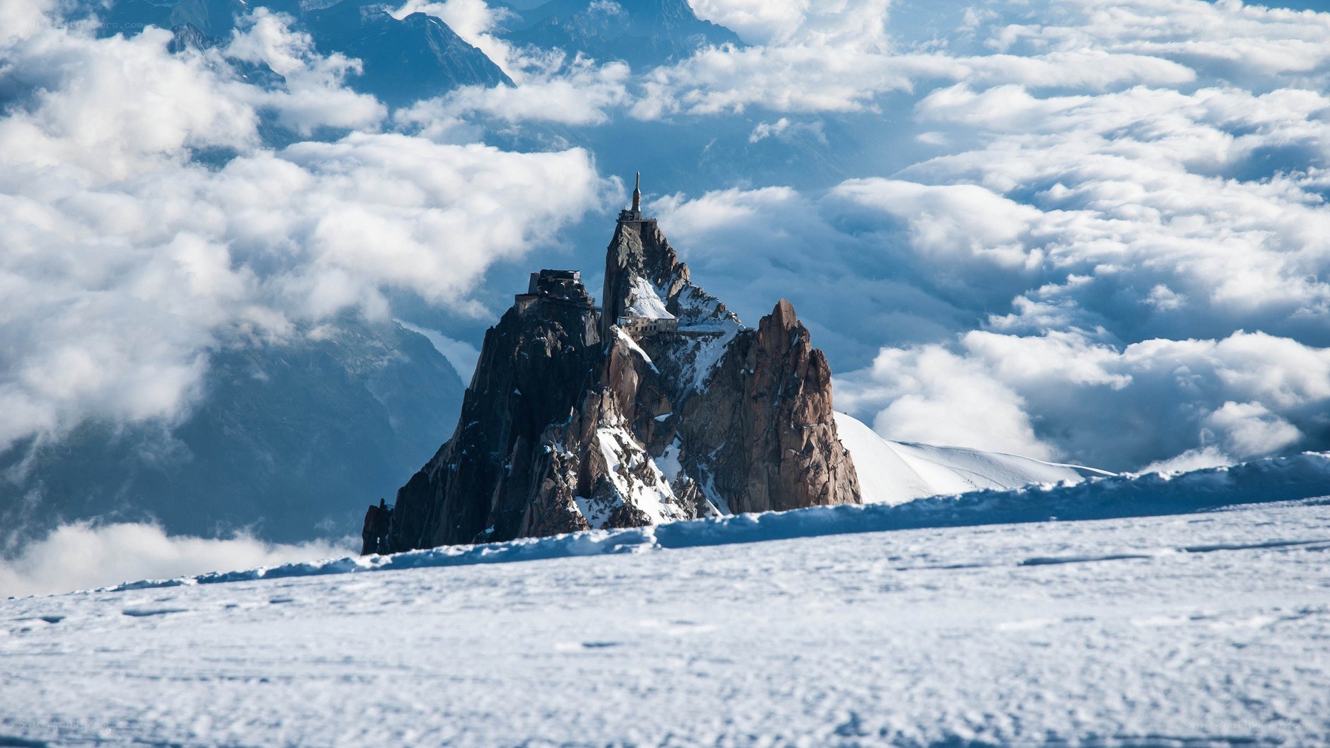 A mountain peak above the clouds