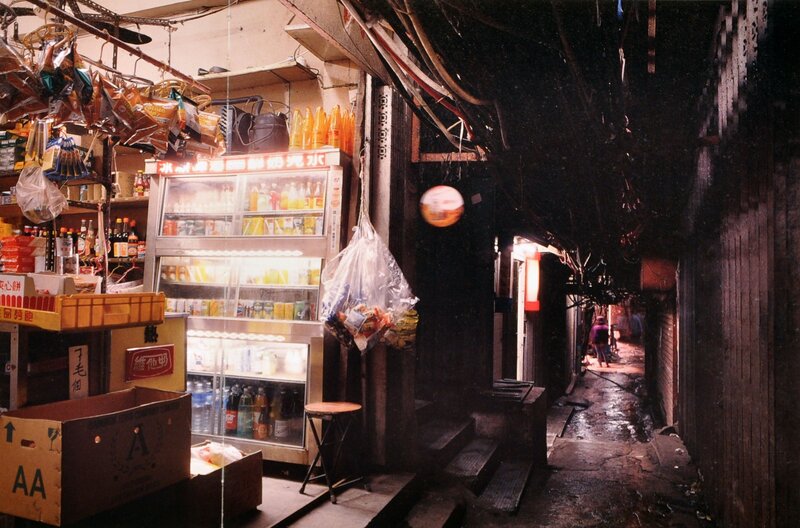 A narrow alley with a small shop
