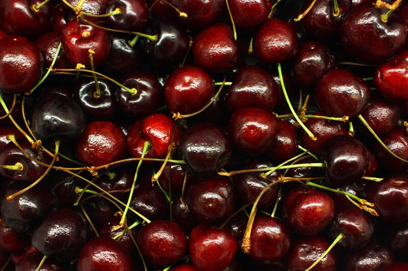 a pile of fresh cherries