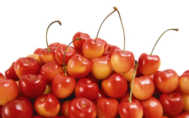 a pile of fresh cherries