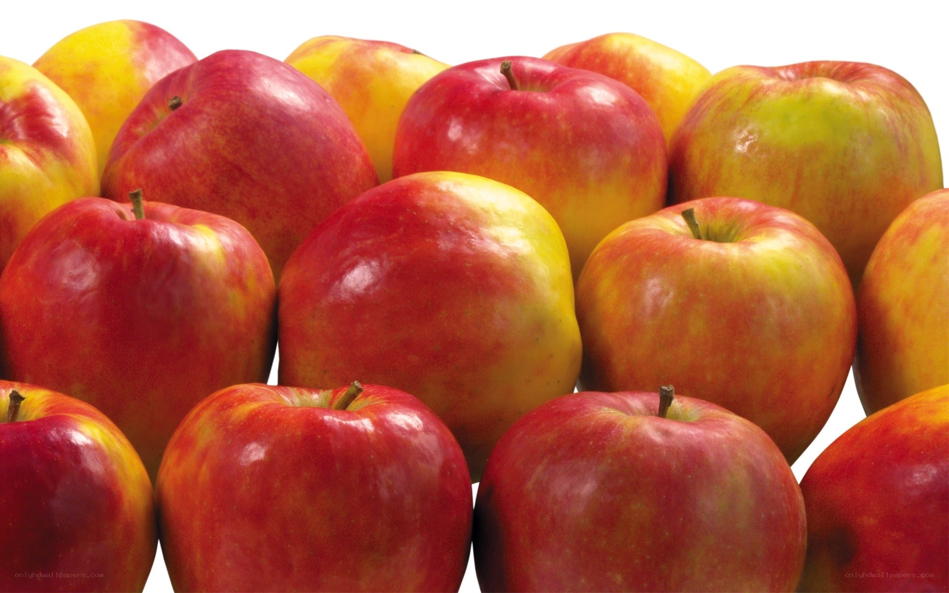 a pile of red and yellow apples