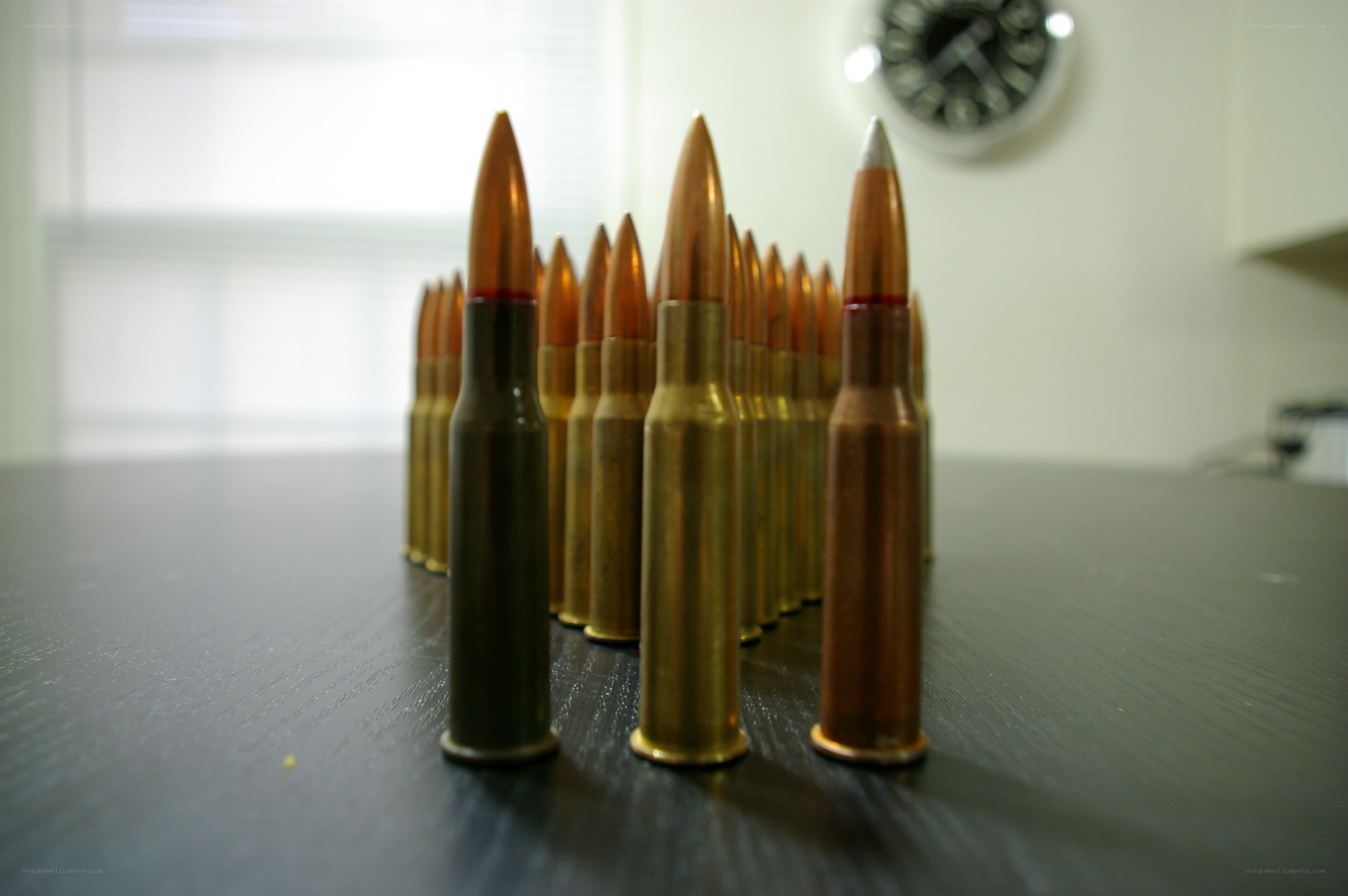 A row of bullets on a table