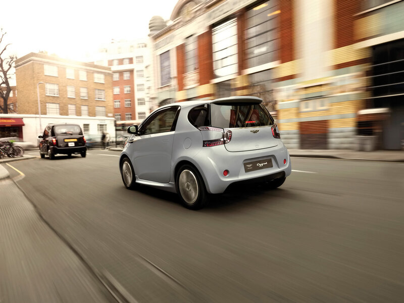 A silver Aston Martin Cygnet in motion