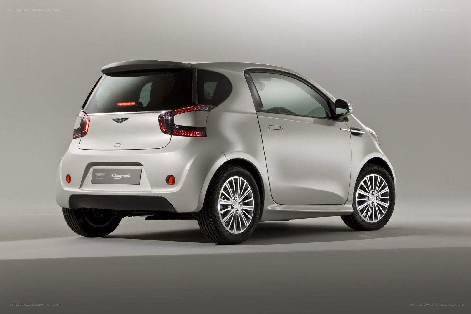 A silver Aston Martin Cygnet
