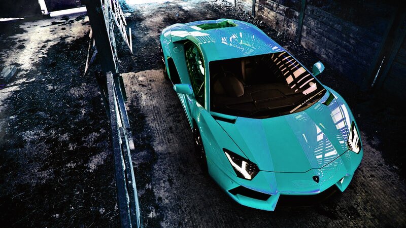a turquoise sports car in a garage