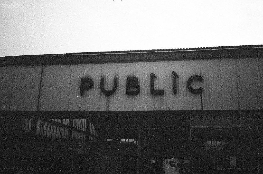 A weathered 'PUBLIC' sign