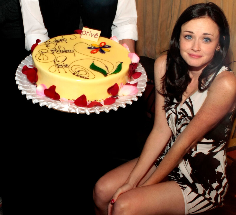 A woman with a birthday cake
