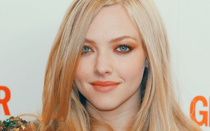 A woman with blonde hair and blue eyes