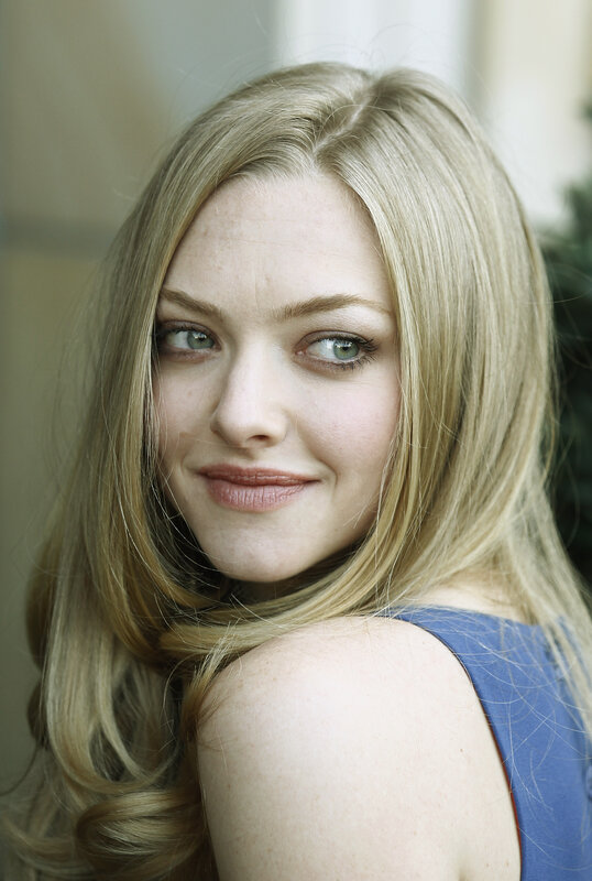 A woman with blonde hair and green eyes