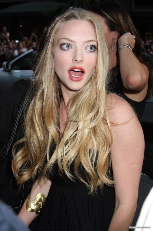 A woman with blonde hair and red lipstick