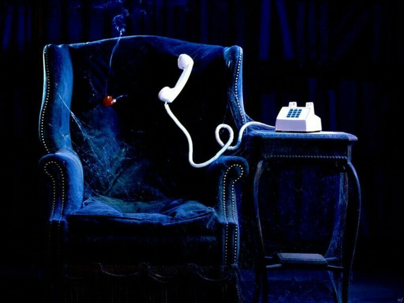 abandoned armchair with phone
