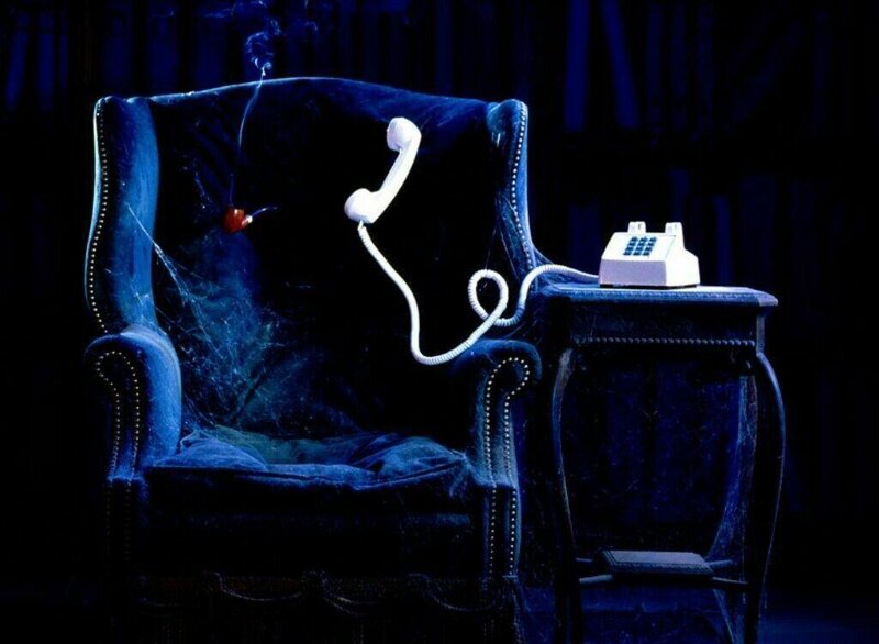 abandoned armchair with telephone
