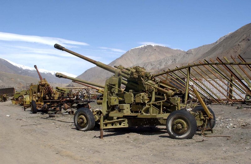 Abandoned artillery in mountain valley