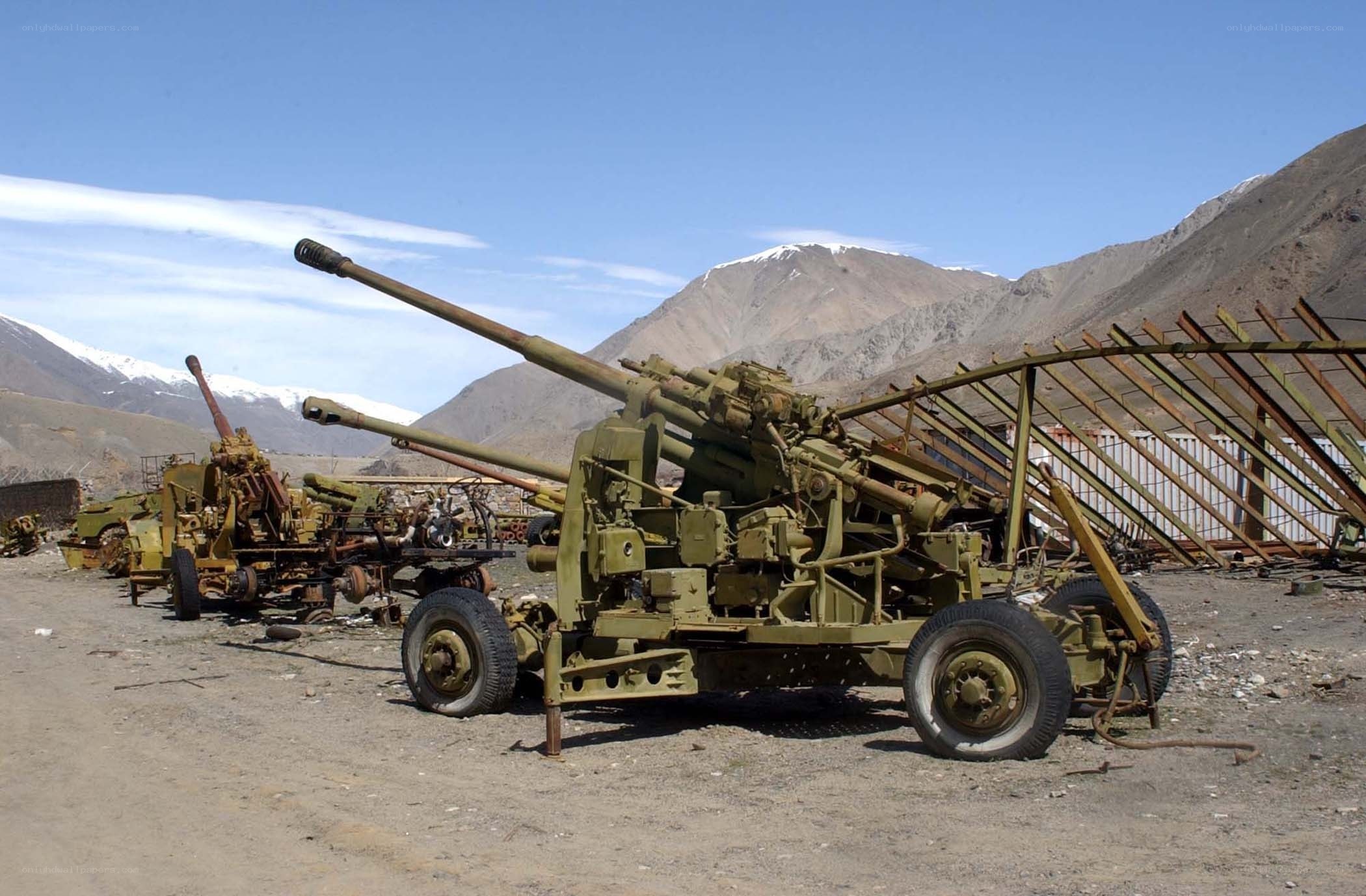 Abandoned artillery in mountain valley