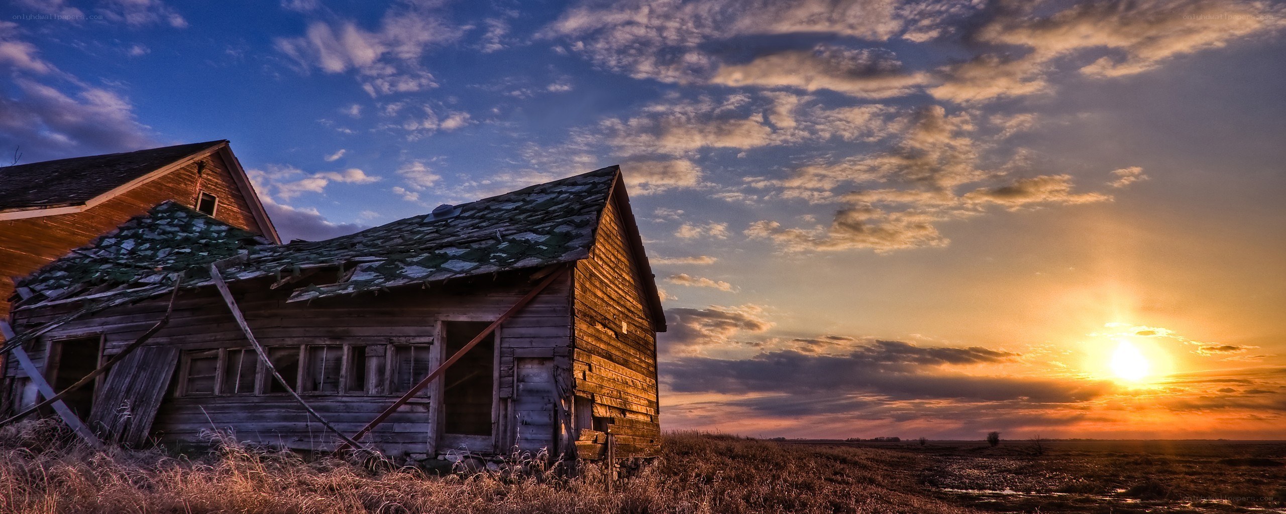 Abandoned barn at sunset