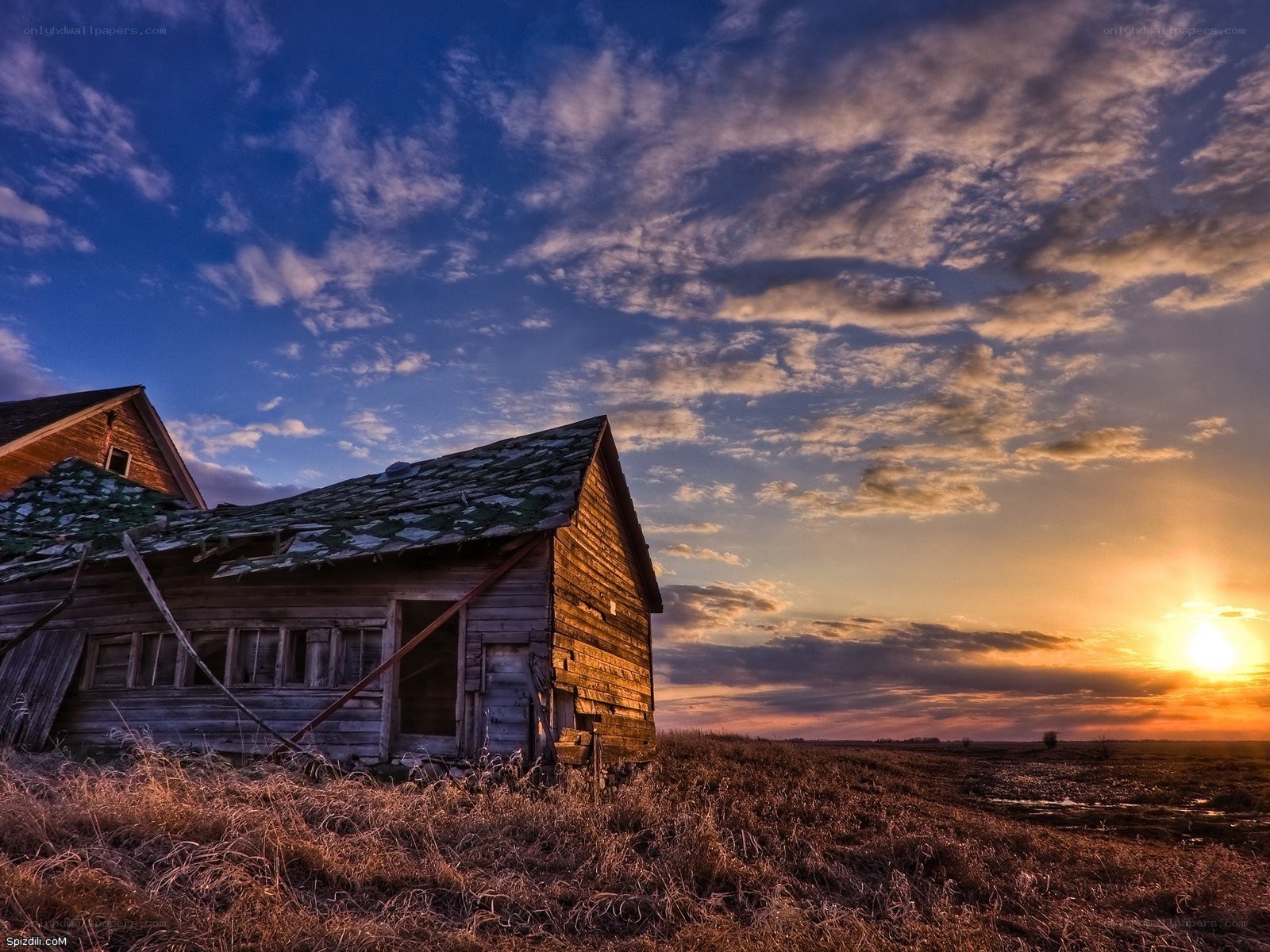 Abandoned barn at sunset