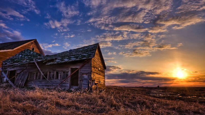 Abandoned barn at sunset