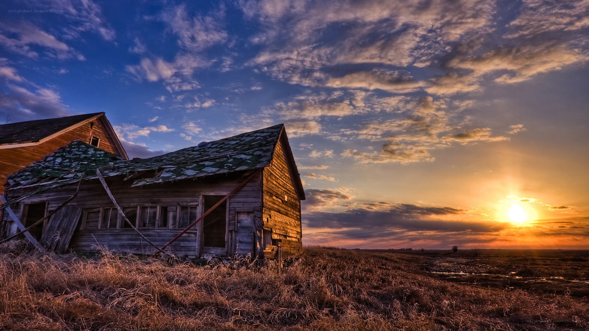 Abandoned barn at sunset