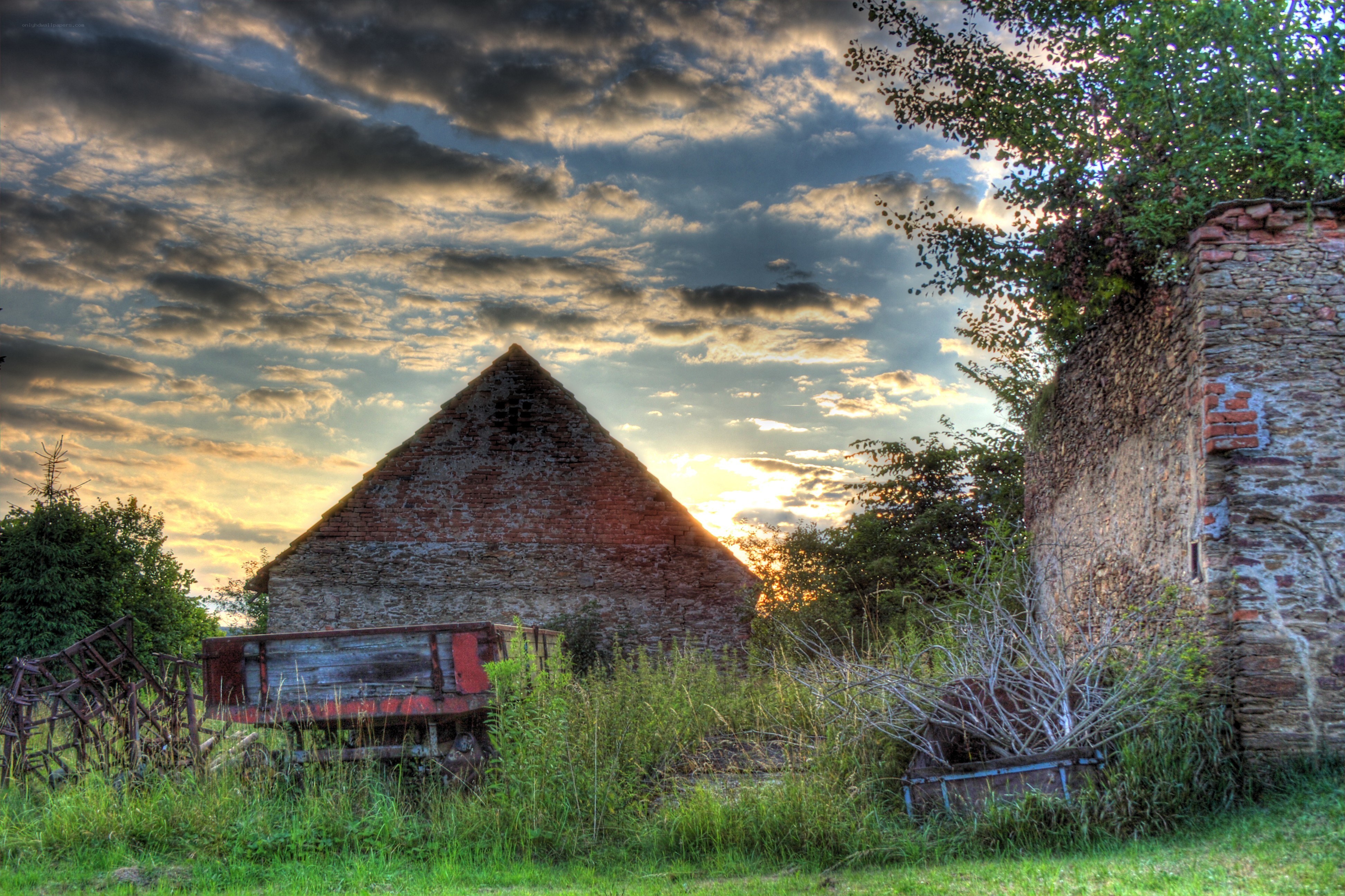 Abandoned barn at sunset