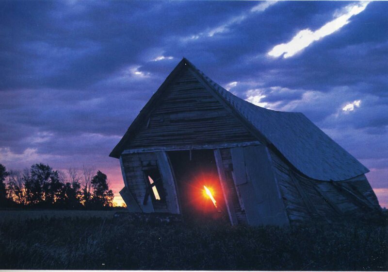 Abandoned barn at sunset