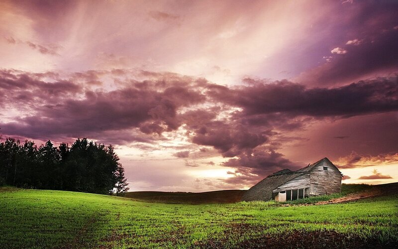 Abandoned barn at sunset