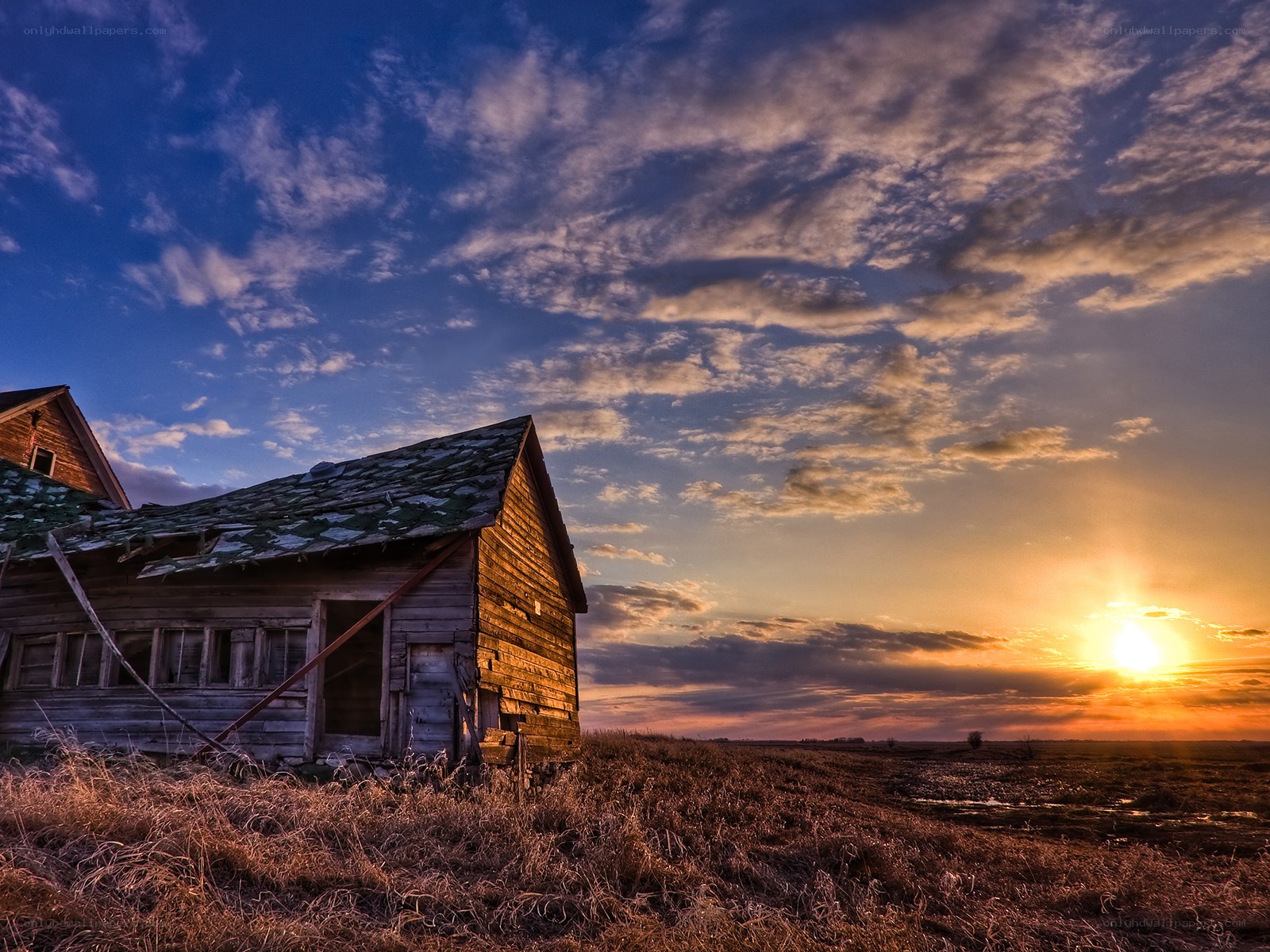 Abandoned barn at sunset