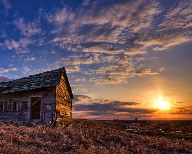 Abandoned barn at sunset