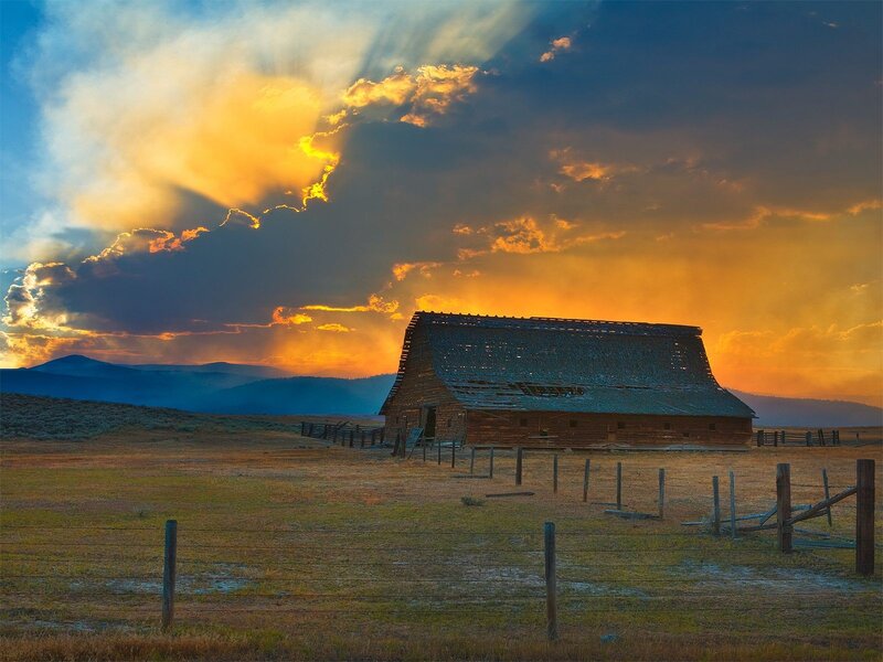 Abandoned Barn at Sunset — Orange, Dramatic, Photograph, Fence, Mountains