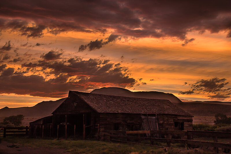 Abandoned Barn at Sunset — Orange, Dramatic, Photograph, Mountains