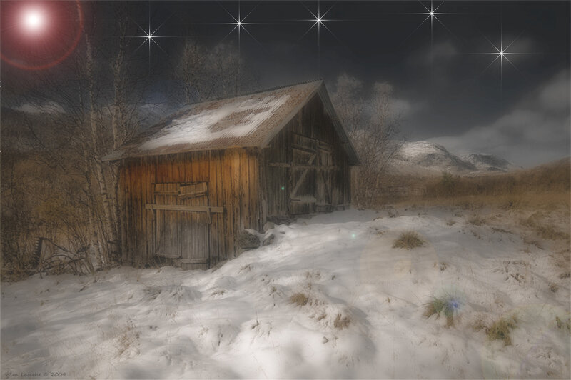 Abandoned barn in snowy landscape