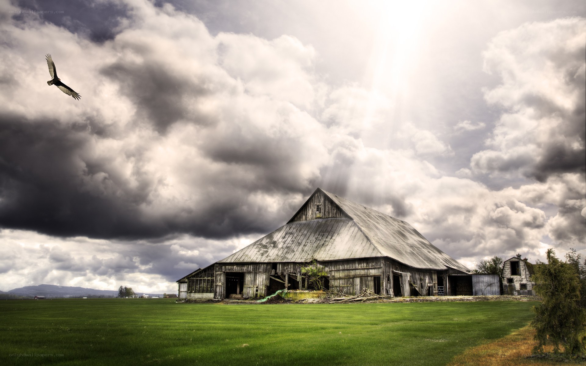 Abandoned barn under stormy sky