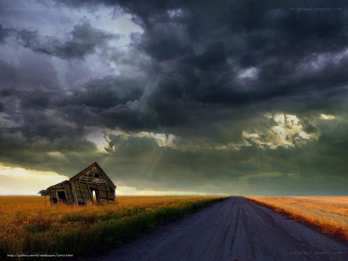 Abandoned Barn Under Stormy Sky