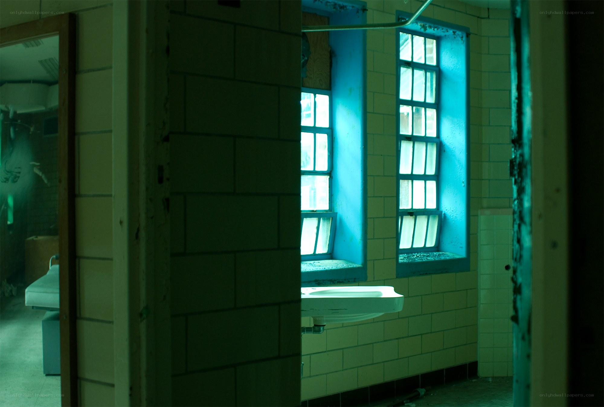 abandoned bathroom with blue windows