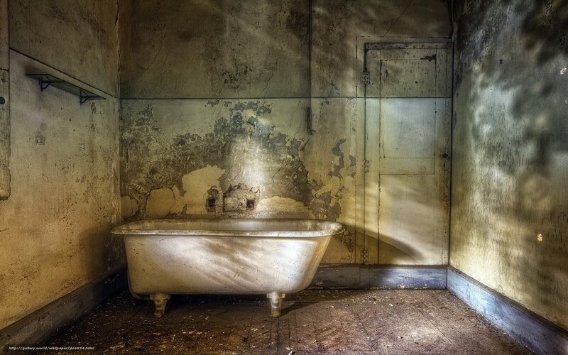 abandoned bathroom with clawfoot tub