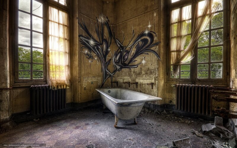 abandoned bathroom with graffiti